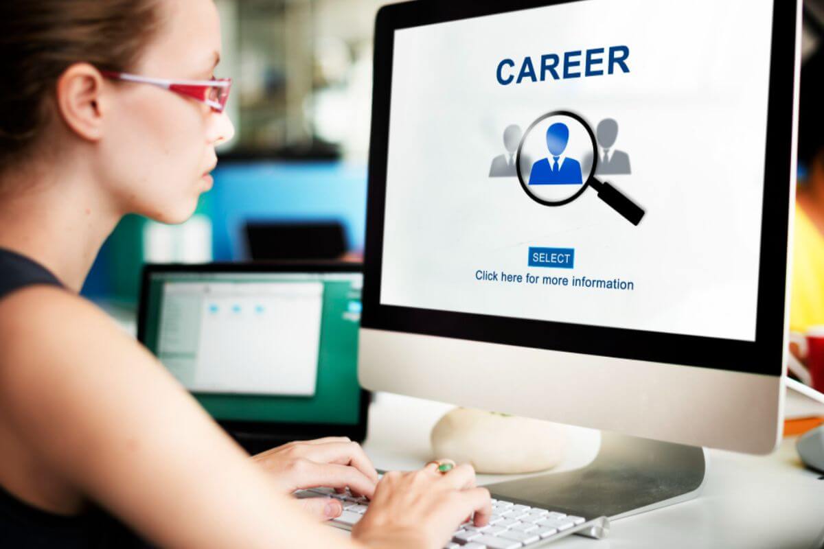 Woman reviewing career advancement opportunities aligned with her employer’s growth and professional development pathways.